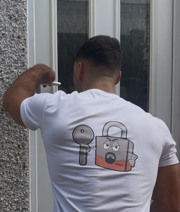 Regan from LockMunn Locksmith fitting a lock on a uPVC door